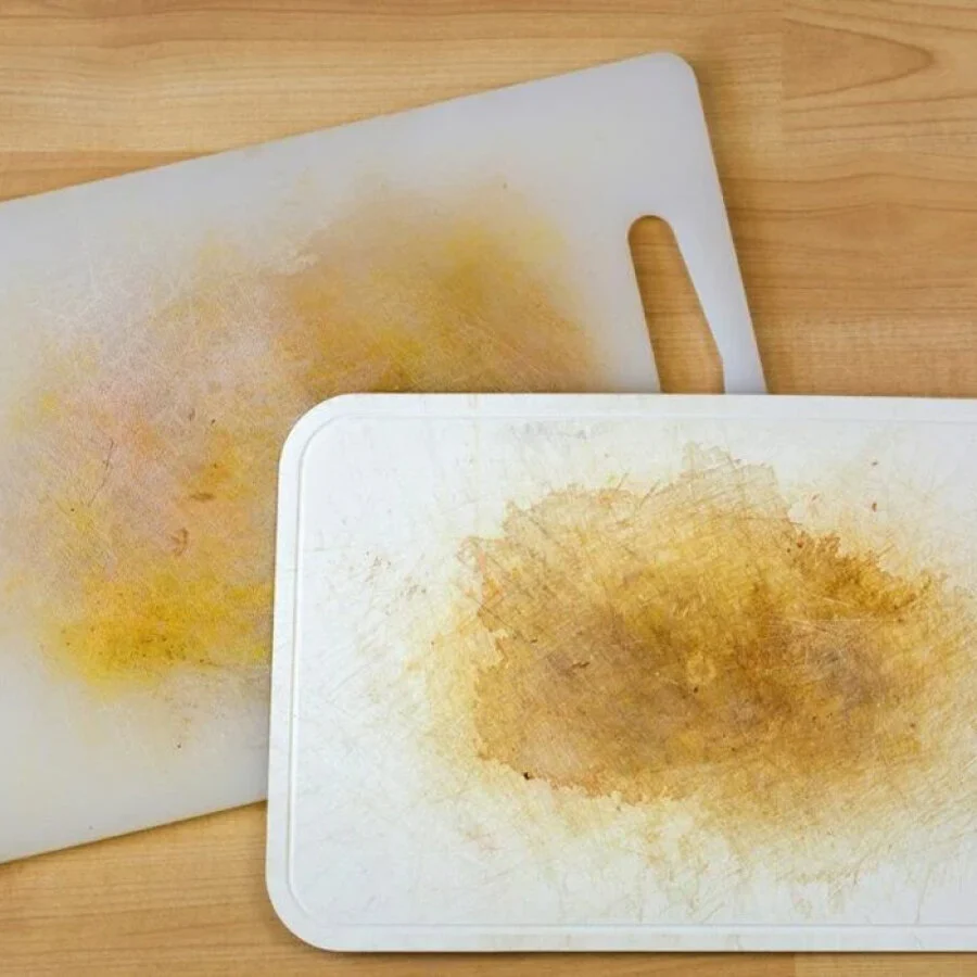 Stained white plastic cutting board